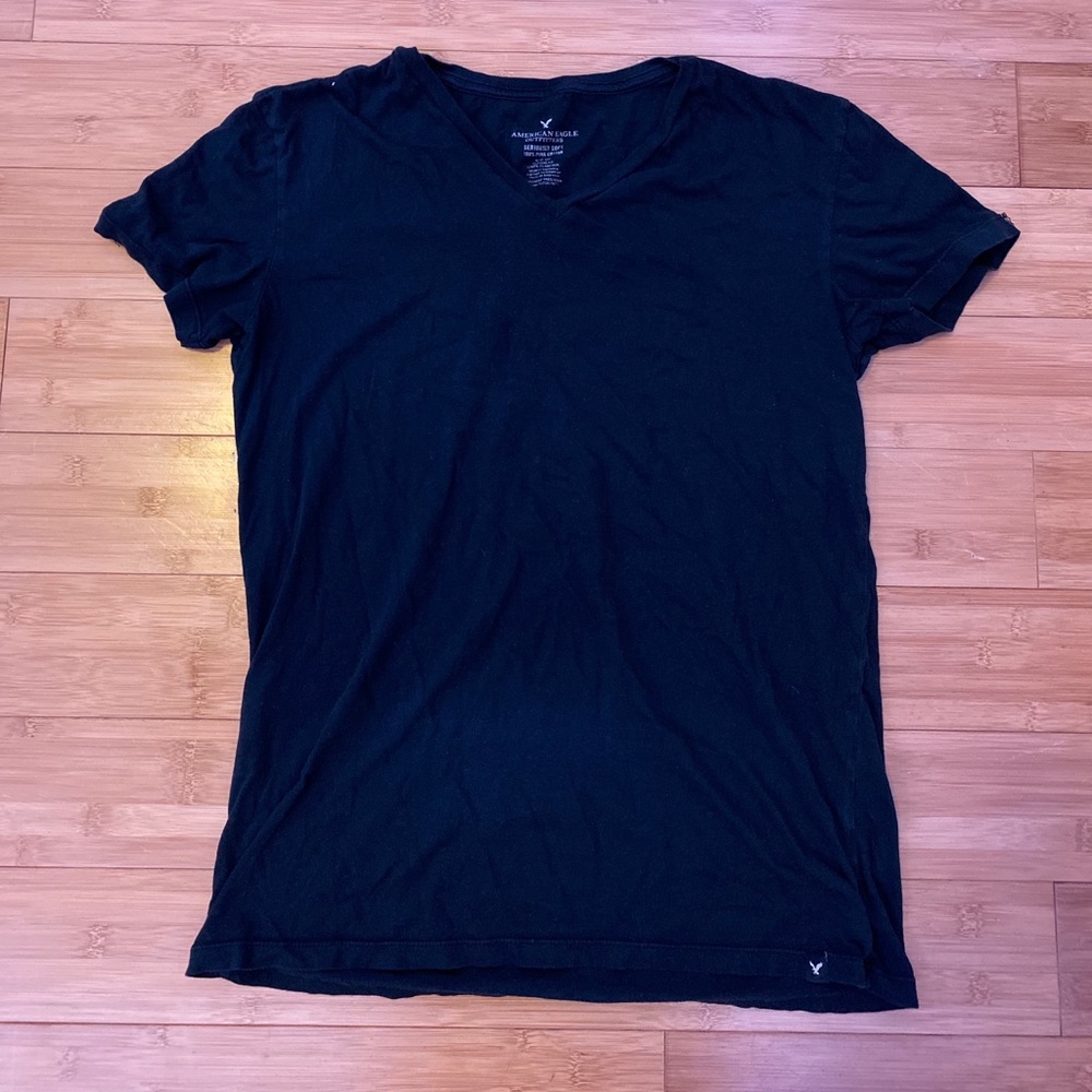 Black v-neck t-shirt.